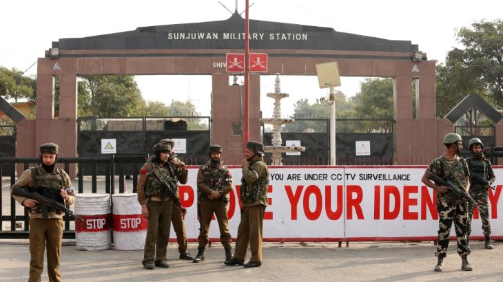Indian army soldiers stand guard outside an army camp after suspected militants attacked the camp, in Jammu