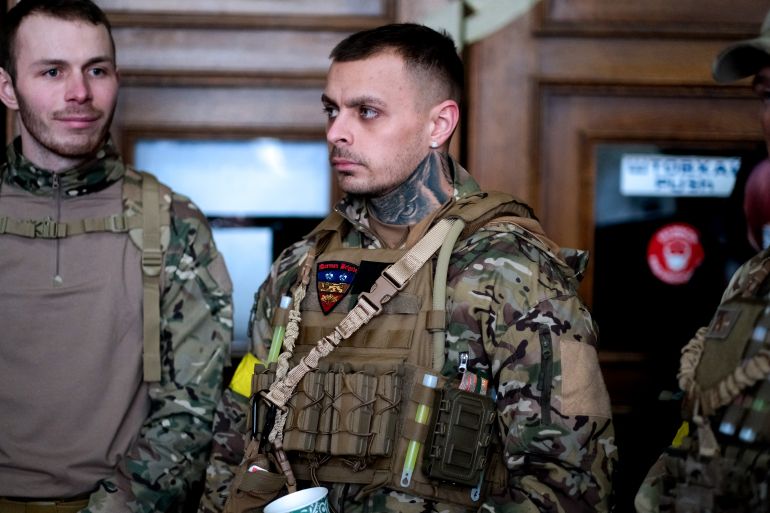 A photo of three ex-British Servicemen.