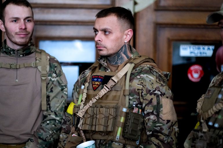 A photo of three ex-British Servicemen.