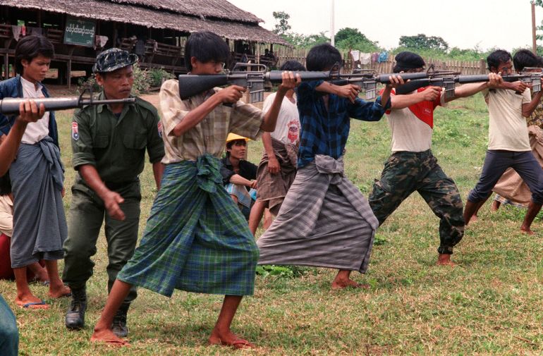 Burmese students wearing traditional longyi (sarong-type wraps) get training from Karen rebels in 1988