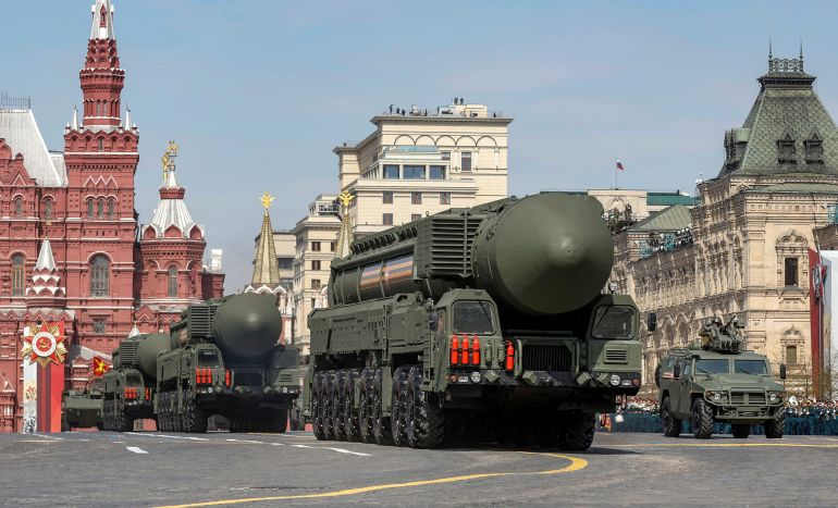 Russian military vehicles, including Yars intercontinental ballistic missile systems, drive in Red Square during a rehearsal for a military parade