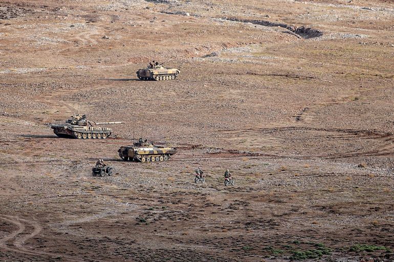 This handout photo provided by Iran's Revolutionary Guard Corps (IRGC) official website via SEPAH News on October 20, 2022 shows the Islamic Revolutionary Guard Corps (IRGC) taking part in a military drill in the northwestern region of Aras along the borders of Armenia and Azerbaijan.