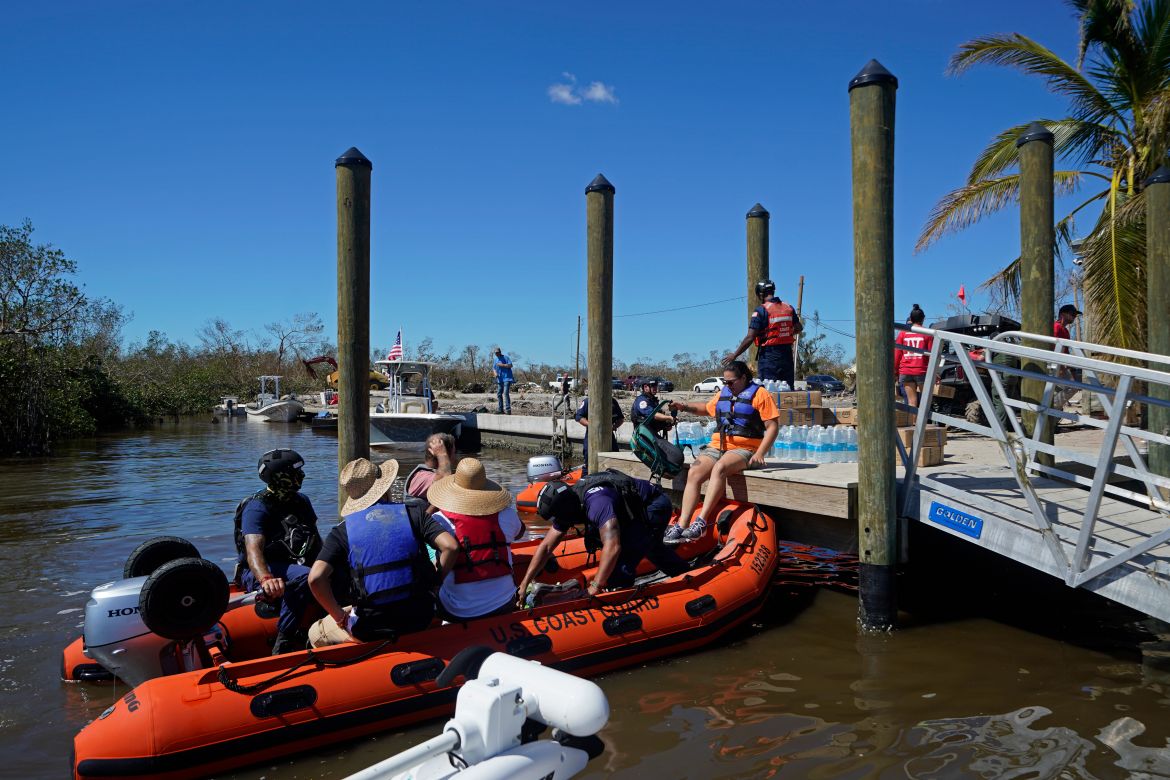 Coast Guard personnel help evacuate residents who rode out the storm, in the aftermath of Hurricane Ian on Florida's Pine Island, in Lee County