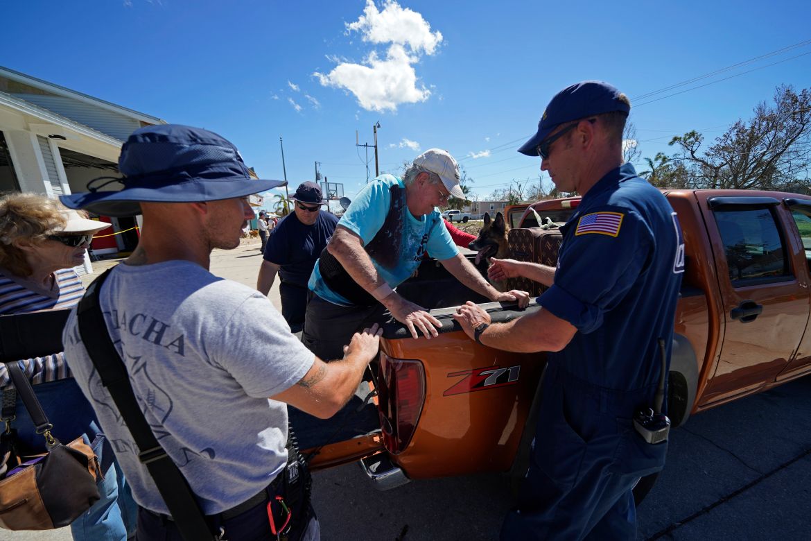 Responders help evacuate Andy Sherwood, a resident who rode out the storm, and had a hip replacement five weeks earlier, in the aftermath of Hurricane Ian on Pine Island