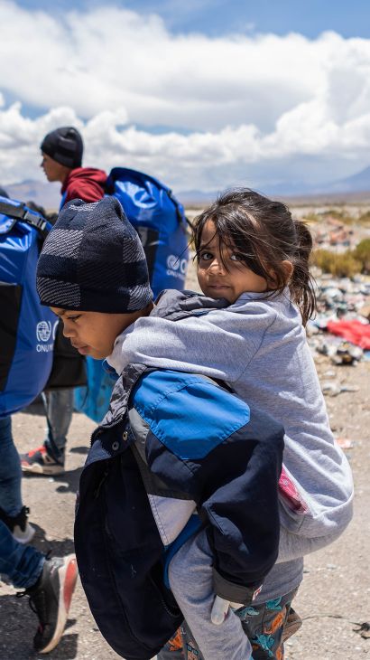 Allyson riding on her sibling's back