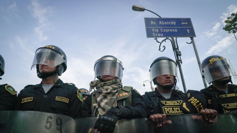 A line of riot police in Lima, Peru, standoff against anti-government protesters in January
