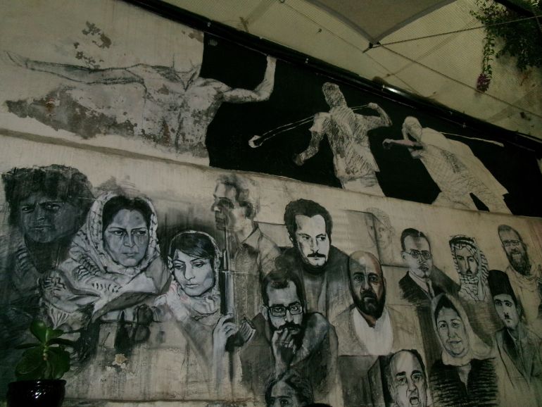 A wall at the Citadel restaurant in the West Bank, with sketches of iconic Palestinians, on October 10, 2023 [Laila Shadid/XEn News]