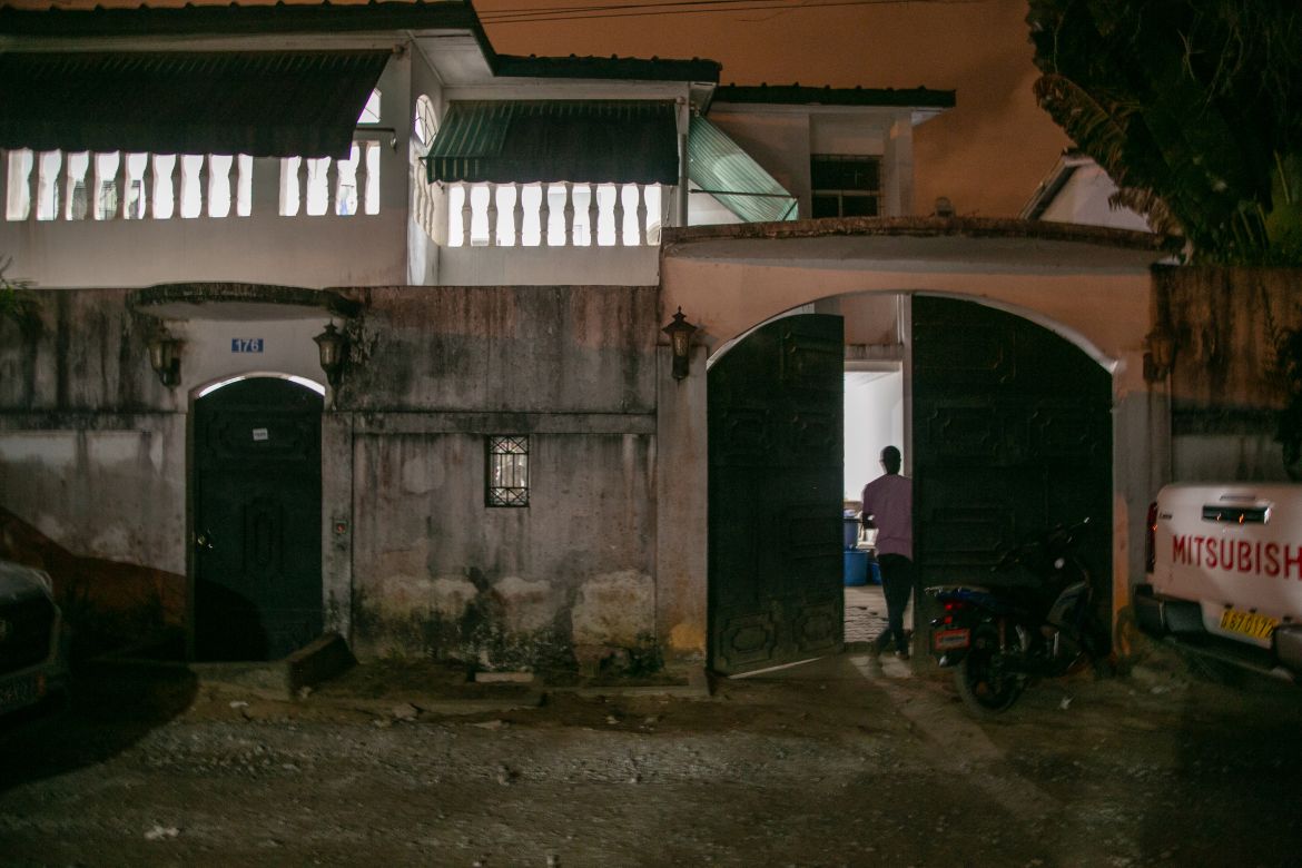 A man stands at the entrance of the Kol-Yehuda Synagogue