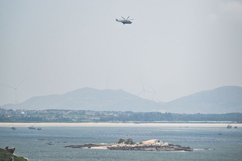 A Chinese military helicopter flies over Pingtan island