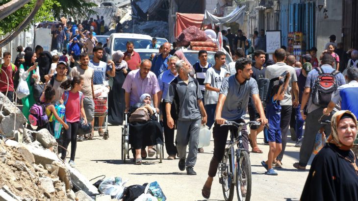 People flee al-Bureij refugee camp in the central Gaza Strip following Israeli bombardment on July 23, 2024