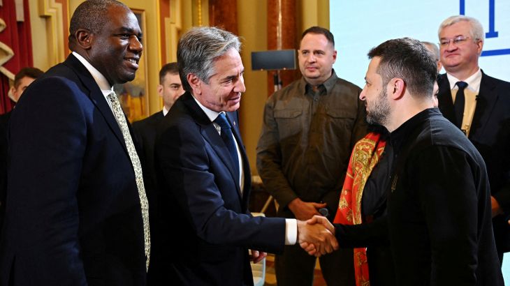 US Secretary of State Antony Blinken, shakes hands with President of Ukraine Volodymyr Zelenskiy as UK Foreign Secretary David Lammy looks on, during the Fourth Crimea Platform Leaders Summit on September 11, 2024 in Kyiv, Ukraine. The British Foreign Secretary joined his American counterpart on a visit to Ukraine to discuss the country's military needs in its fight against Russia. Leon Neal/Pool via REUTERS