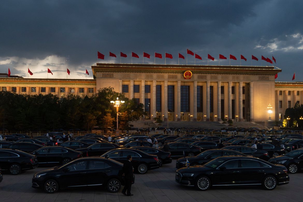 Drivers wait for attendees of the National Day Reception held at the Great Hall of the People on the eve of the 76th anniversary of the founding of the People's Republic of China in Beijing, China,