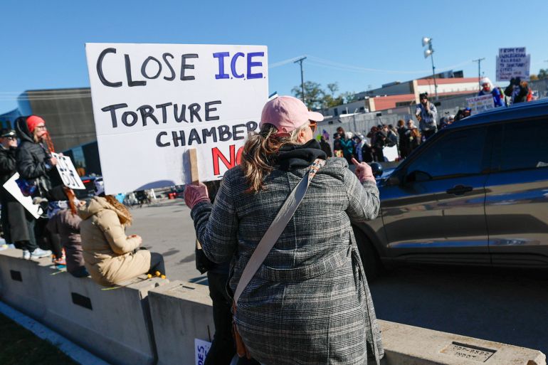 Demonstrators protest against Immigration and Customs Enforcement (ICE) outside an ICE facility in Broadview, Illinois on October 24, 2025.