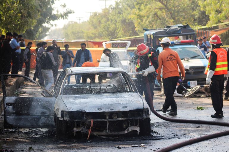 Burned out car at bomb site.