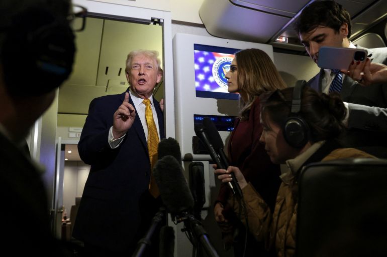 U.S. President Donald Trump speaks to reporters aboard Air Force One en route from Florida to Joint Base Andrews, Maryland, U.S., January 4, 2026. REUTERS/Jonathan Ernst