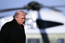 US President Donald Trump walks from Marine One to board Air Force One at Joint Base Andrews, Maryland on January 27, 2026.